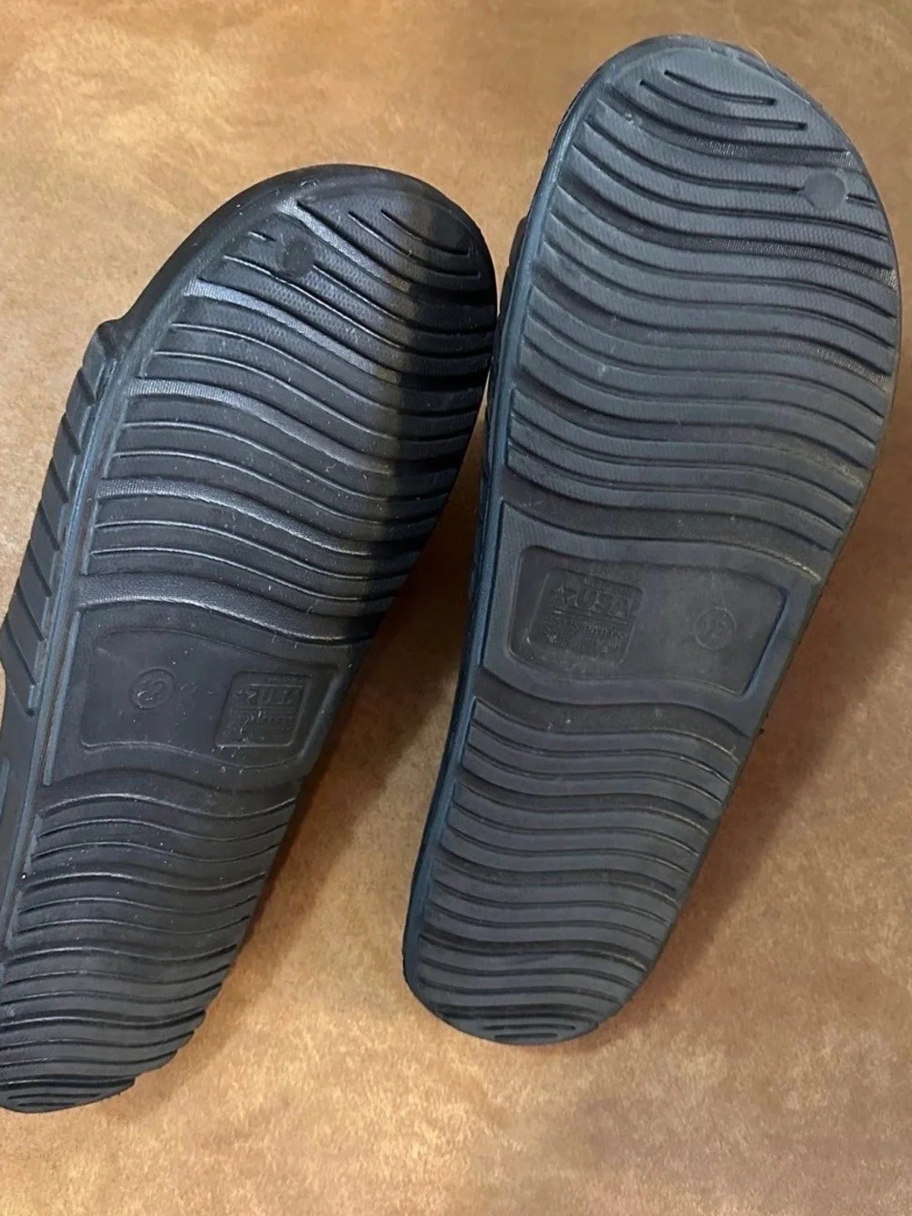 Black slides, men’s size 12, in good-worn once condition